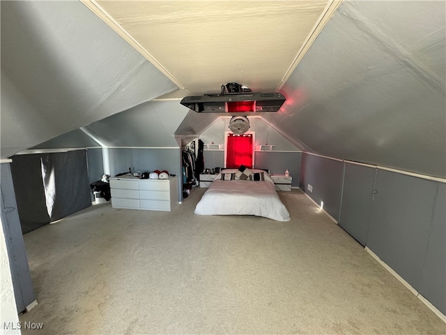 unfurnished bedroom with lofted ceiling and light carpet