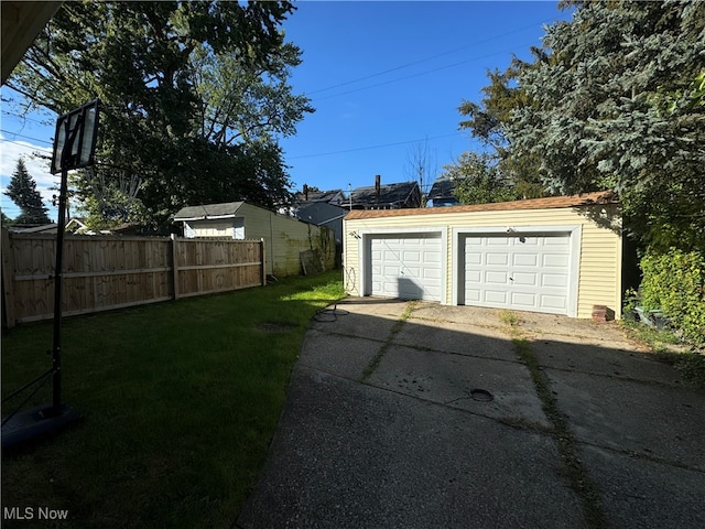 garage featuring a lawn