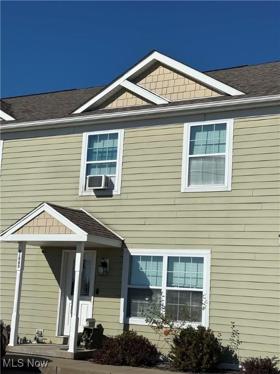 51945 William Ln, Saint Clairsville, OH 43950 - view of front of home featuring roof with shingles and cooling unit