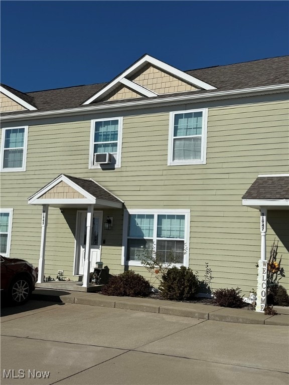 view of front of home featuring cooling unit