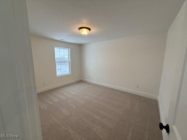 spare room with carpet flooring