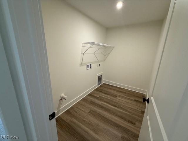 washroom featuring washer hookup, dark hardwood / wood-style flooring, gas dryer hookup, and hookup for an electric dryer