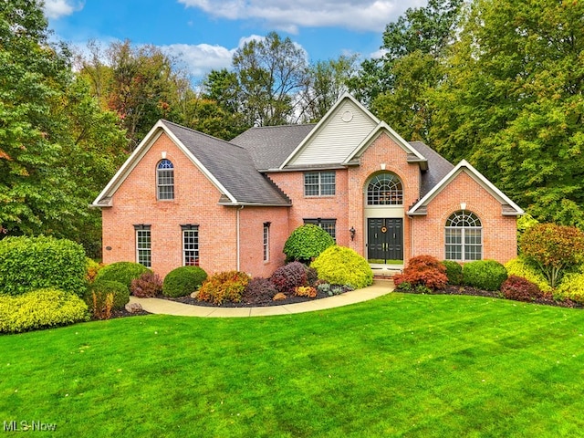 view of property with a front lawn