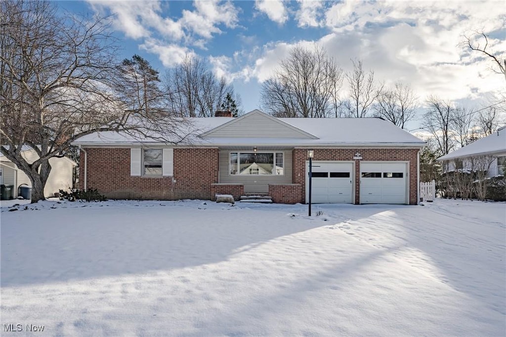 single story home featuring a garage