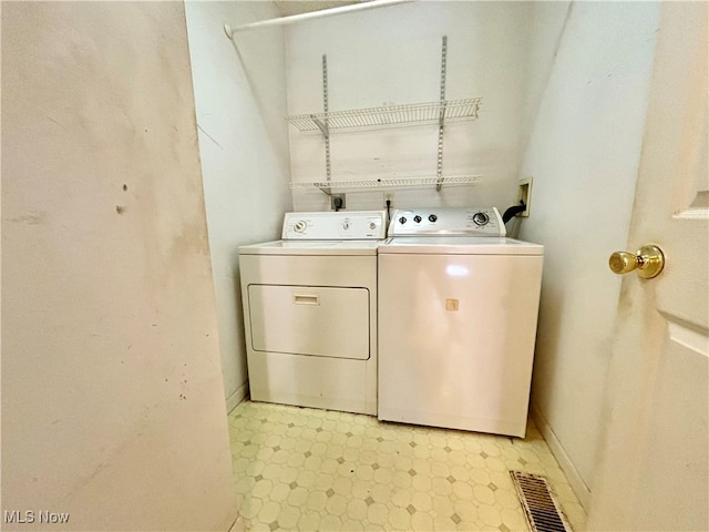 laundry area featuring washer and clothes dryer