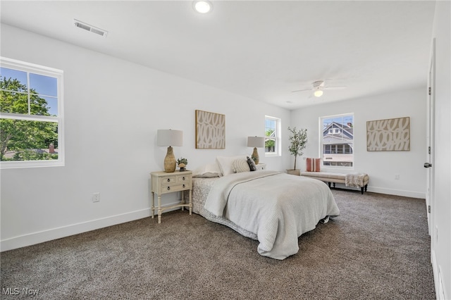 bedroom with ceiling fan and carpet floors