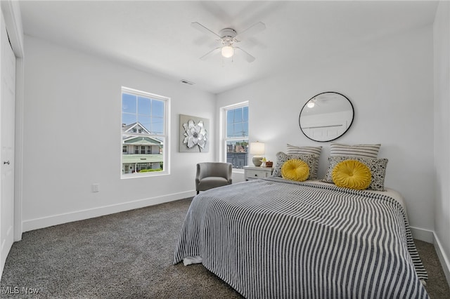 bedroom featuring a closet, ceiling fan, and dark colored carpet