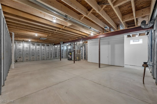 basement with electric water heater and heating unit