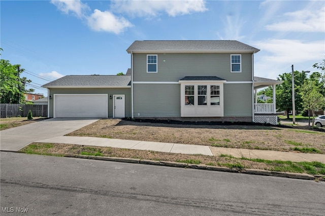 front of property featuring a porch and a garage