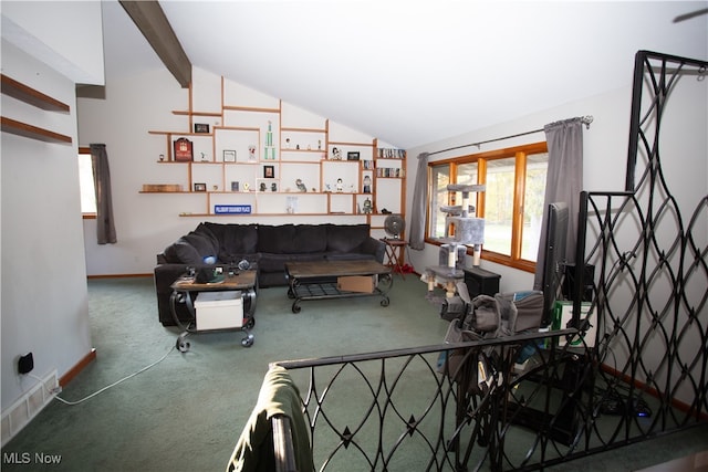 carpeted living room featuring vaulted ceiling with beams and a healthy amount of sunlight