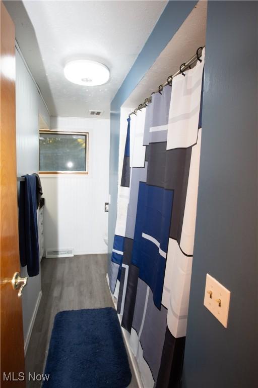 bathroom with hardwood / wood-style floors