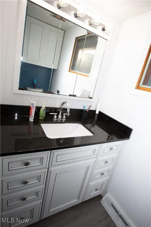 bathroom featuring hardwood / wood-style floors and vanity