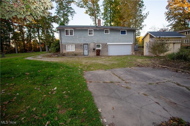 rear view of property with a lawn