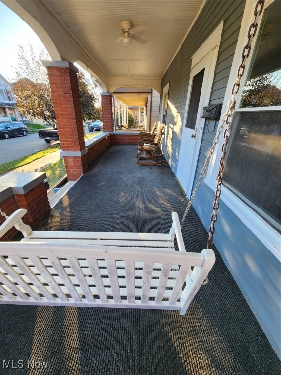 view of patio featuring covered porch and ceiling fan