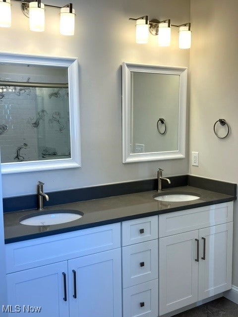 bathroom with vanity and walk in shower