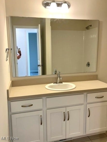 bathroom featuring vanity and tile patterned floors