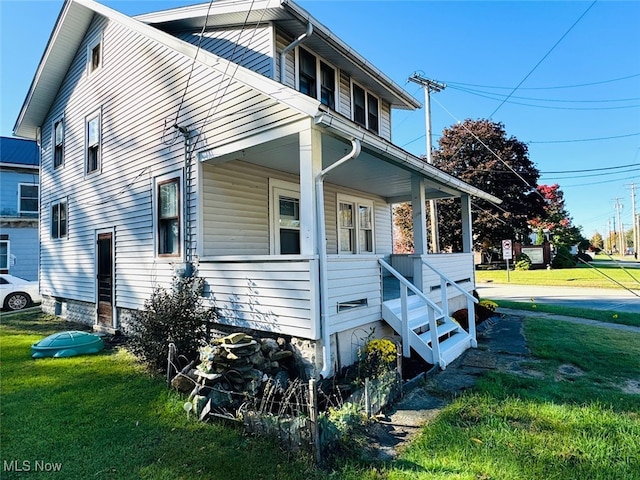 view of side of home featuring a lawn