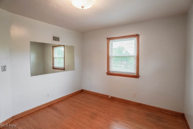 spare room featuring hardwood / wood-style flooring