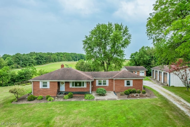 view of front of house featuring a garage and a front lawn