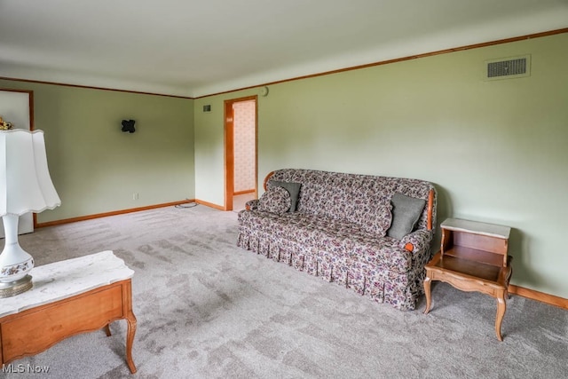 living room featuring crown molding and light colored carpet