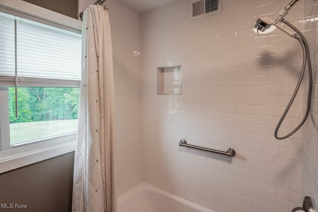 bathroom featuring shower / bath combo