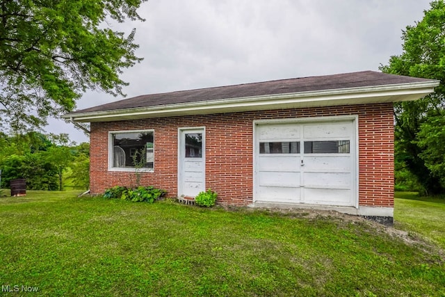 garage with a lawn