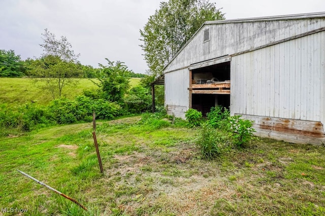 view of outbuilding with a lawn