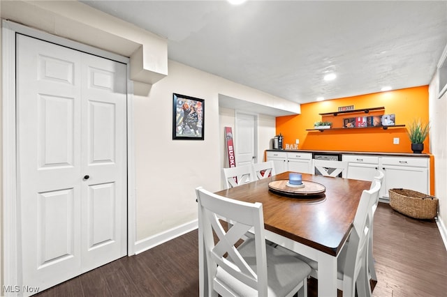 dining area featuring dark wood-type flooring