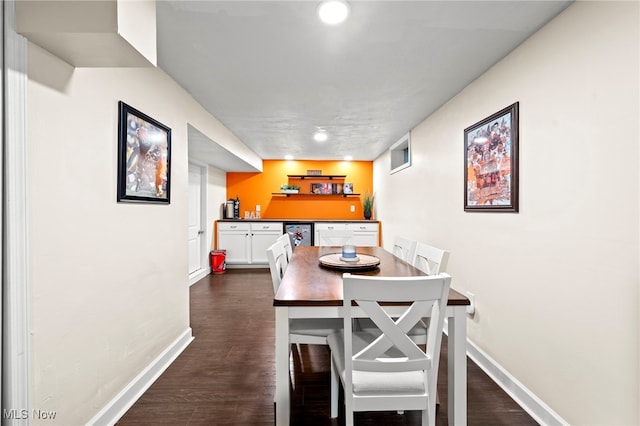 dining room with dark hardwood / wood-style flooring