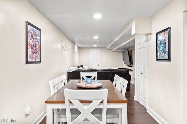 dining space featuring dark hardwood / wood-style floors