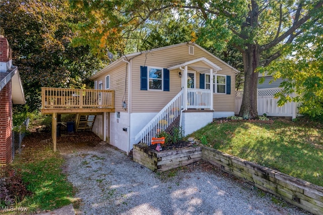 view of front of house with a wooden deck