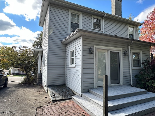 rear view of property with a wooden deck