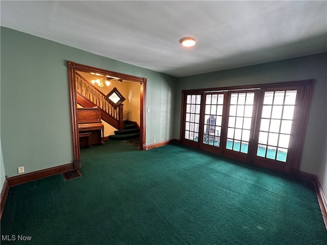 unfurnished room featuring dark colored carpet