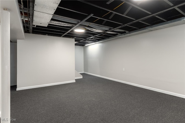 basement with dark carpet