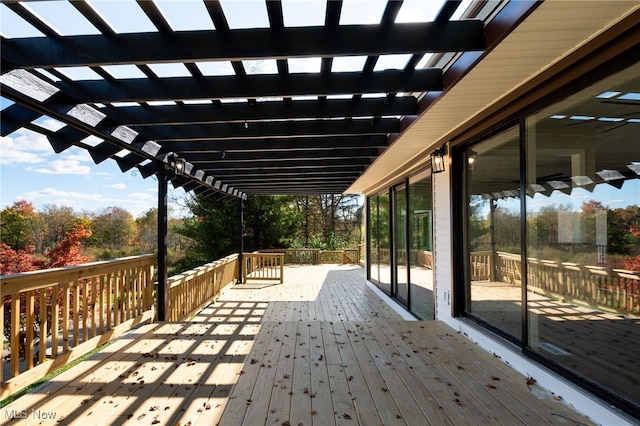 wooden deck featuring a pergola