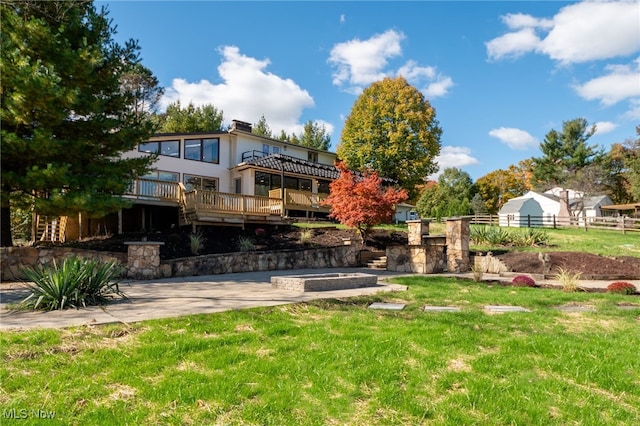 view of yard with a patio and a wooden deck