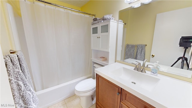 full bathroom featuring toilet, shower / tub combo, vanity, and tile patterned flooring