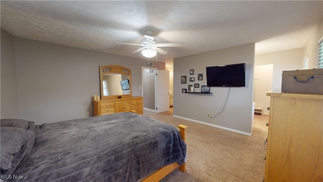 bedroom with ceiling fan, a textured ceiling, and light colored carpet