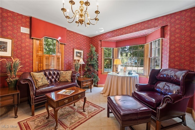 sitting room with carpet flooring and a notable chandelier