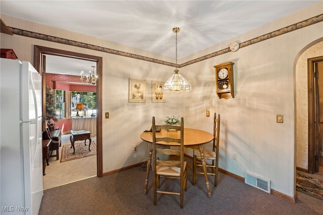 dining area with carpet