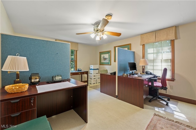 home office featuring ceiling fan and light colored carpet