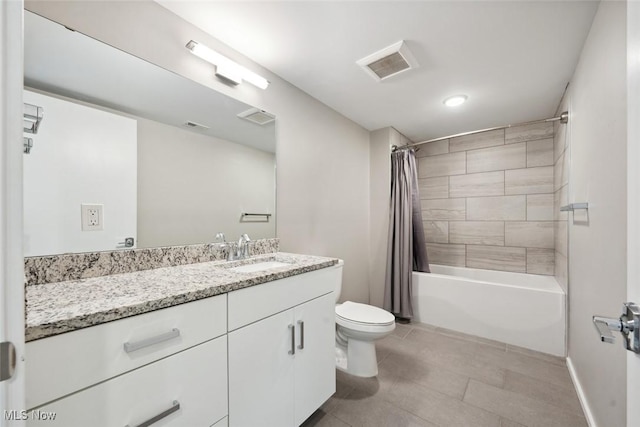 bathroom with toilet, vanity, visible vents, tile patterned floors, and shower / tub combo with curtain