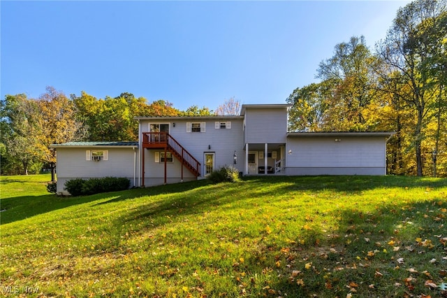 back of house featuring a yard