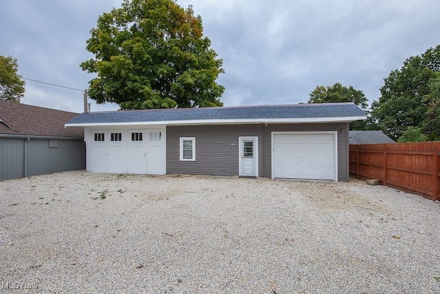 garage featuring wood walls