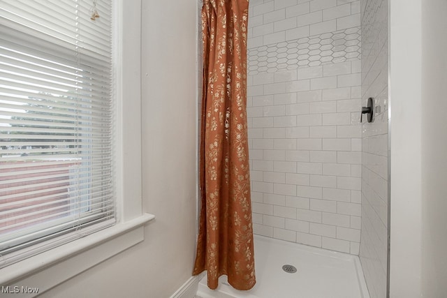 bathroom with a shower with shower curtain