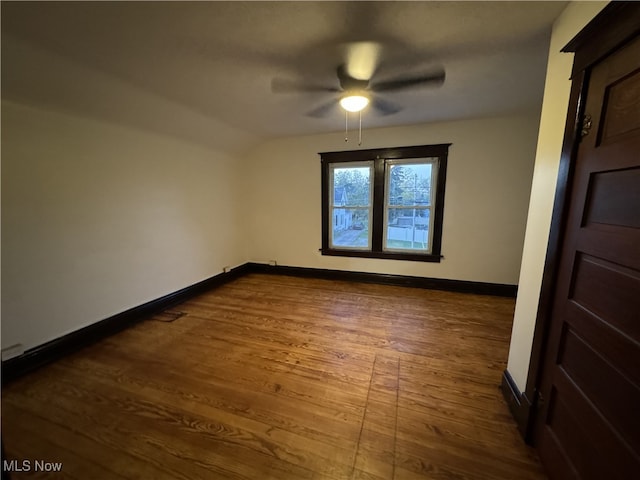 spare room with ceiling fan and dark hardwood / wood-style flooring