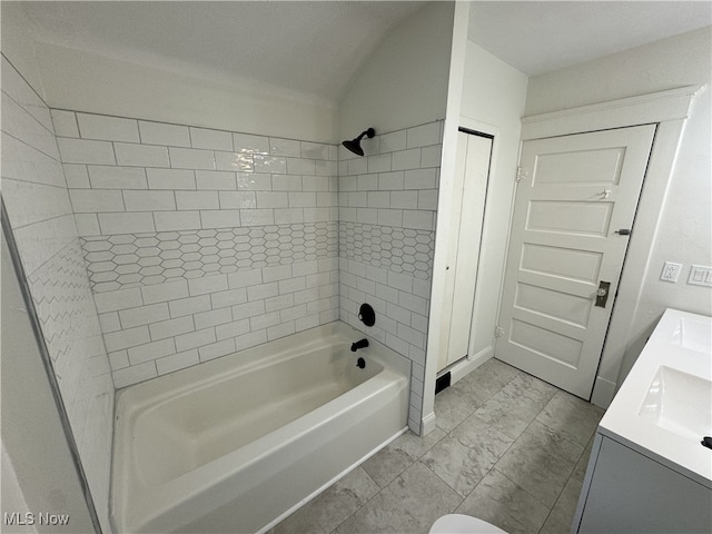 bathroom featuring vanity and tiled shower / bath combo