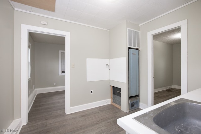 bathroom with crown molding and wood-type flooring