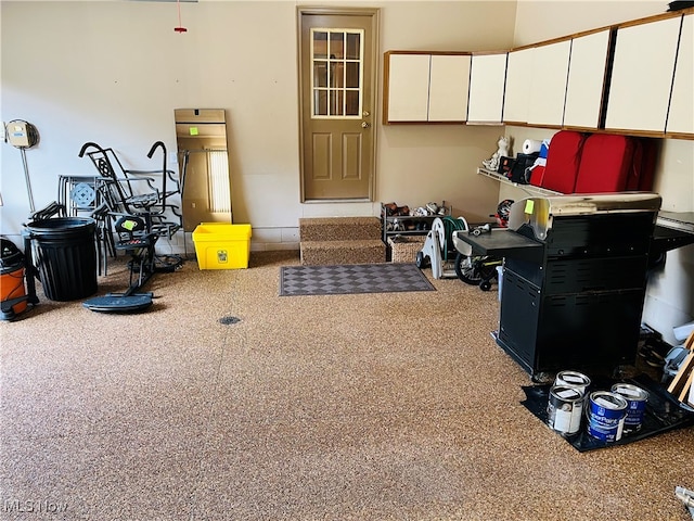 interior space with white cabinets and carpet