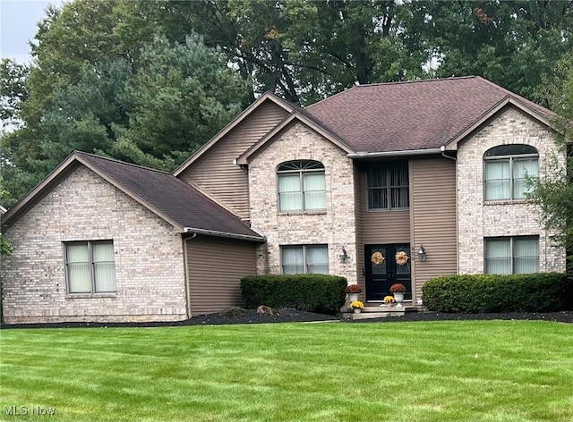 view of front facade with french doors and a front yard